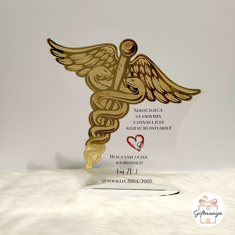 Prozirna akrilna plaketa sa zlatnim medicinskim simbolom kaducejom i personaliziranom porukom poklon za razrednicu medicinska škola